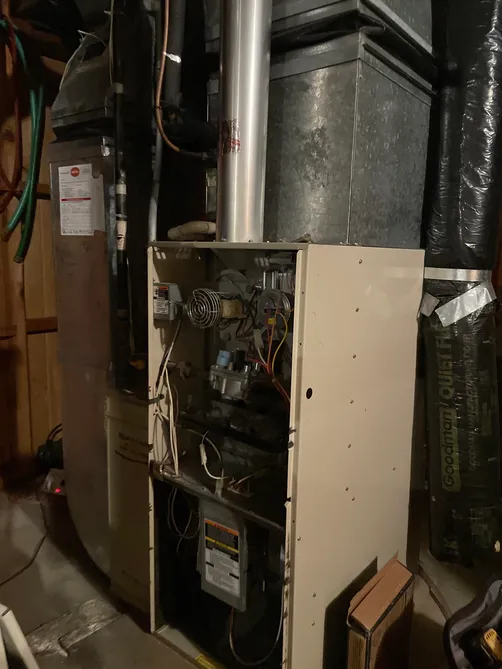 Furnace service and replacement work in a Twin Cities utility room