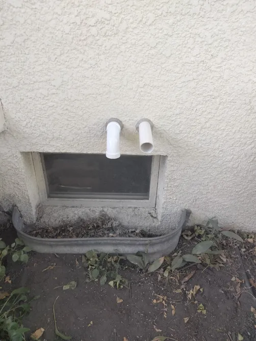 High-efficiency furnace intake and exhaust PVC venting through an exterior wall