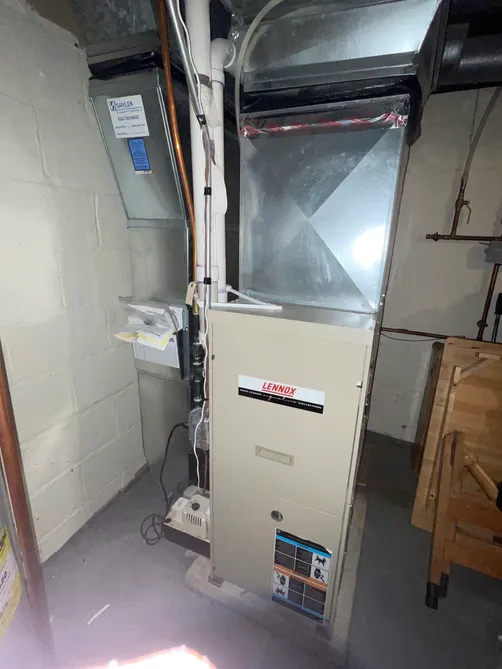 Lennox furnace installed in a tight basement mechanical closet