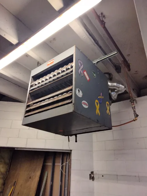 Commercial suspended unit heater installed in a Twin Cities shop by Midland Heating & Cooling