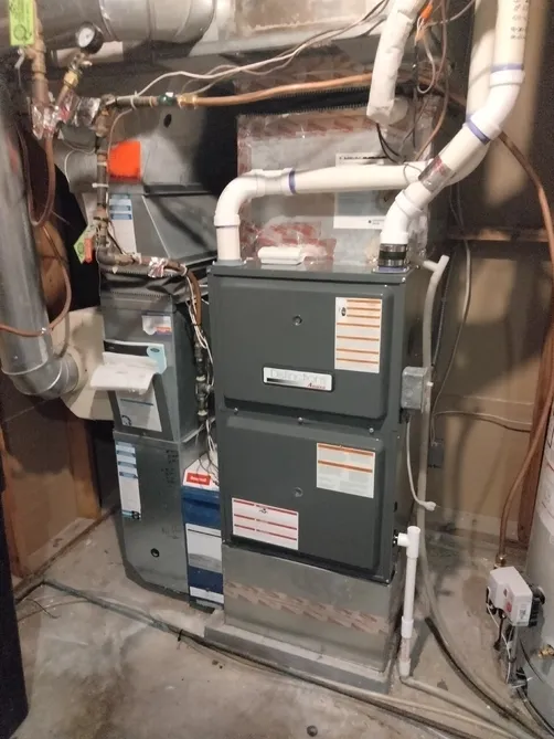 High-efficiency furnace installed with new gas and venting connections