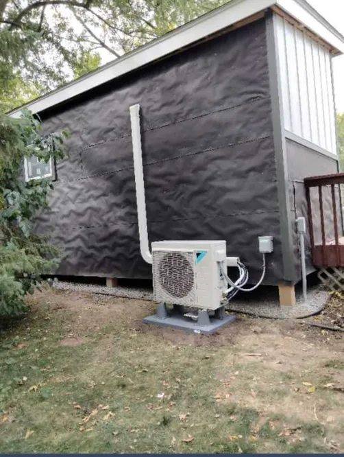 Daikin ductless mini-split outdoor unit installed at a detached studio