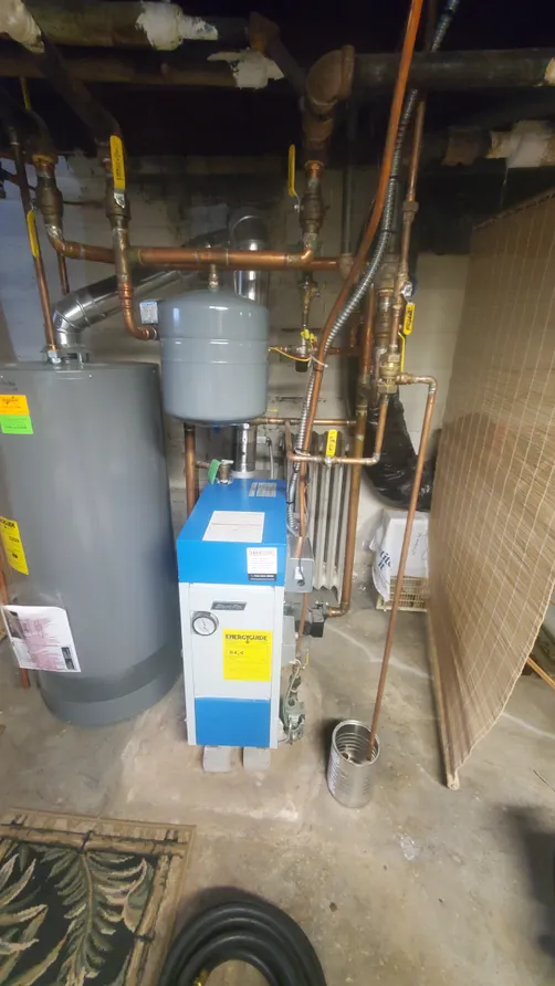 Energy Kinetics boiler and water heater with copper piping installed by Midland Heating & Cooling