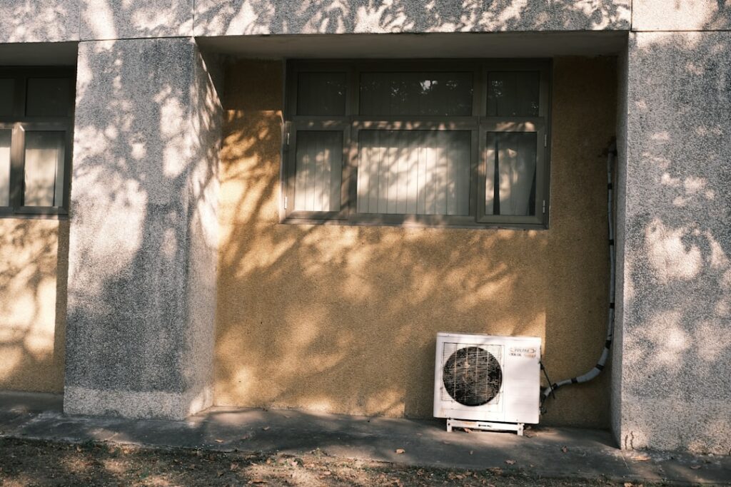 central air conditioning unit outside a Twin Cities home in summer