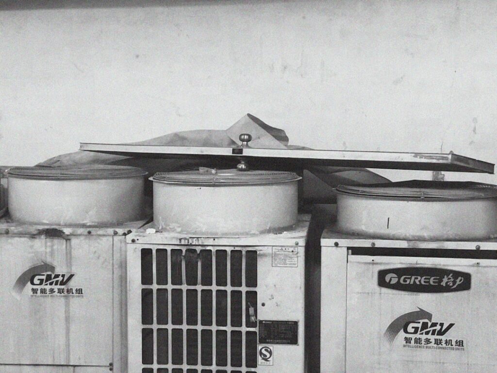 high-efficiency central air conditioner in a Minneapolis backyard during summer