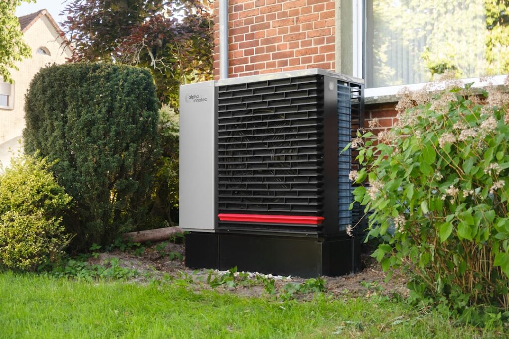 Why Is My Heat Pump Blowing Cold Air in the Middle of Winter? 2 heat pump outdoor unit covered in frost during Minnesota winter